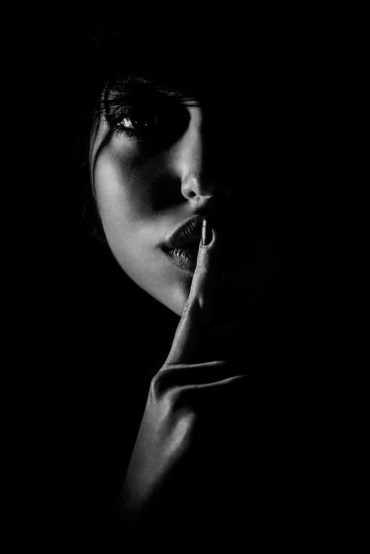 A photo of a woman silencing the world.